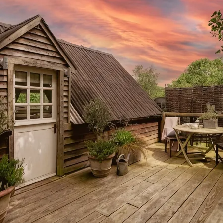 Lofty first floor barn conversion in stunning secluded setting.