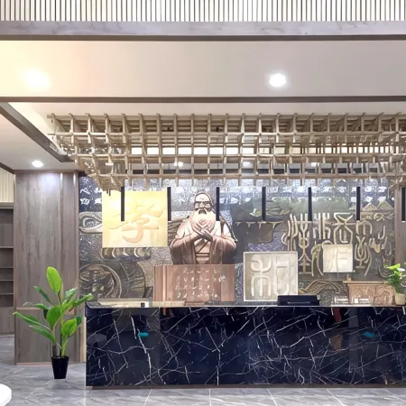 Qufu Xueerxing Hotel (East Railway Station Yuandong College)
