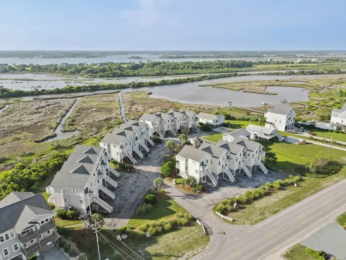 Coastal Getaway with Pool and Beach Access - Linens Included - 4-Star