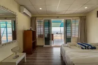 The Tito's Blue Sky Beach Resort - bar