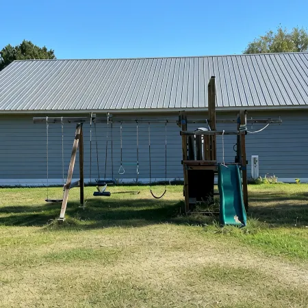 BEAUTIFUL lake front home with a private beach, dock and large yard