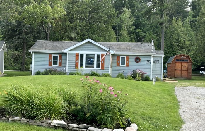 Riverfront Cottage w/ Boat Docking and easy access to Burt Lake