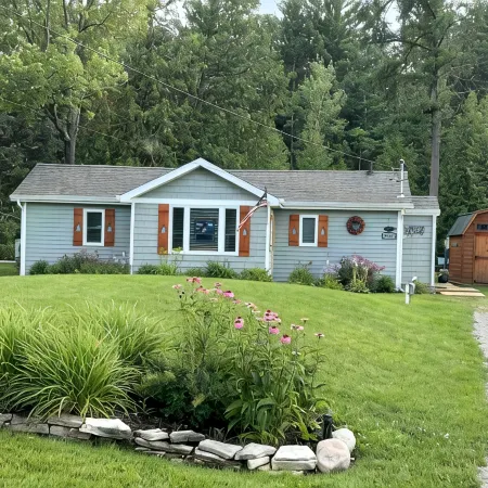 Riverfront Cottage w/ Boat Docking and easy access to Burt Lake