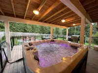 Fun cottage with hot tub, pool table, game room, and a huge deck.