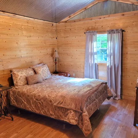 Peaceful cabin in secluded mountain spot beside a picturesque creek