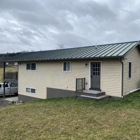 Family friendly cottage, covered deck, close to lake to fish, swim, and boat