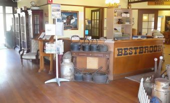 "a store with a wooden counter and a sign that says "" best ever "" in front of it" at Bestbrook Mountain Farmstay