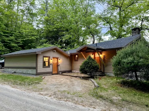 Lakefront cabin with dock, hot tub, fire pit!!