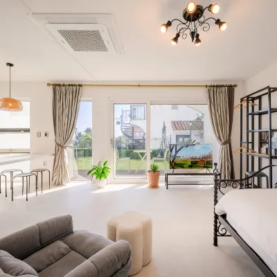Seogwipo Orange Tree House Pension Отели рядом с достопримечательностью «Парк развлечений Seri World»