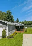 Spacious 4-bedroom waterfront house in Sylvan Beach with private yard and dock.