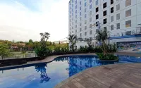 Wooden Touch Studio at Tamansari Skylounge Makassar Apartment By Travelio - Apartments