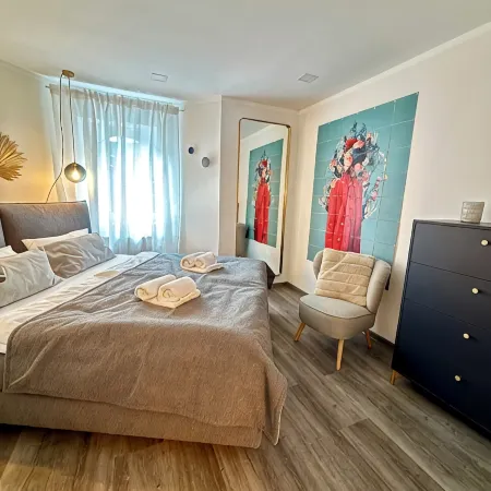 Stylish granny apartment with box-spring bed