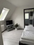 Kleine Ferienwohnung , Direkt am Deich und Hafen von Eckwarden mit Gartennutzung