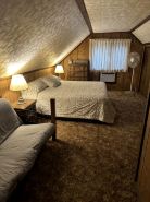 Cozy vacation home nestled in a quiet wooded area. Near town but private