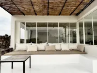 An architectural oasis with large swimming pool, along a breath-taking scenery.