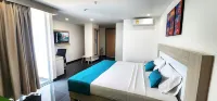 Hotel BE Suites Cali โรงแรมในEl Carmelo