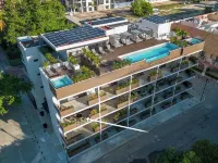 Cozy studio apartment near beach with roof top pool, AC, WiFi