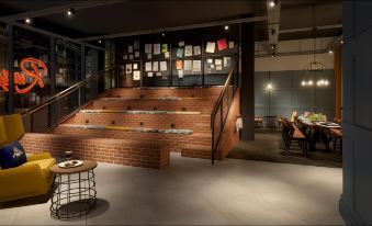 a brick staircase leading up to a restaurant with tables and chairs , creating an inviting atmosphere at voco MANCHESTER - CITY CENTRE