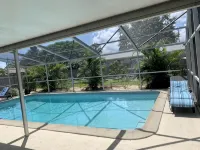 CAPTAIN’S QUARTERS Tropical pool house. Airport, Beaches, Usssa sports complex - ติดทะเล