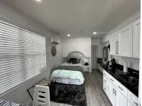 Modern studio apartment with covered outside seating area