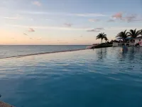 Steps from beach and infinity pool, Golf Cart Optional - Pools