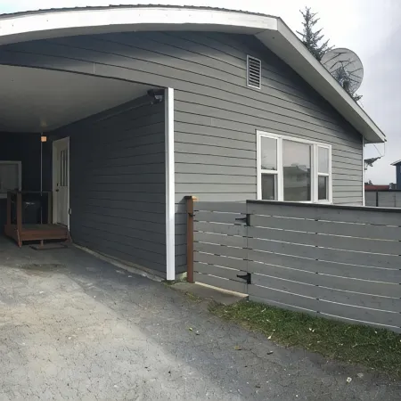 3 bed 2 bath house w/ covered parking spot and fenced backyard.