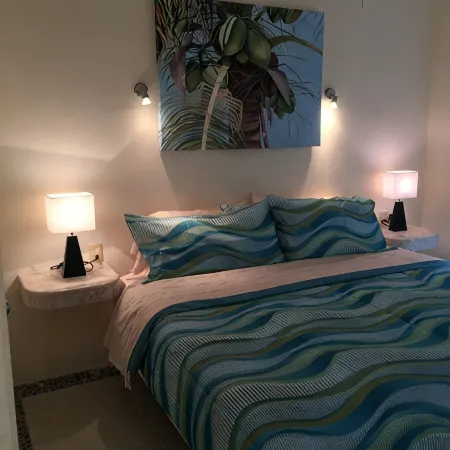 Quiet and serene ocean front 2-bedroom 2-bathroom condo, steps from the sand!