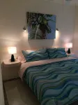 Quiet and serene ocean front 2-bedroom 2-bathroom condo, steps from the sand!