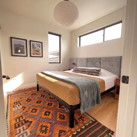 Sunlit loft with fireplace and king bed