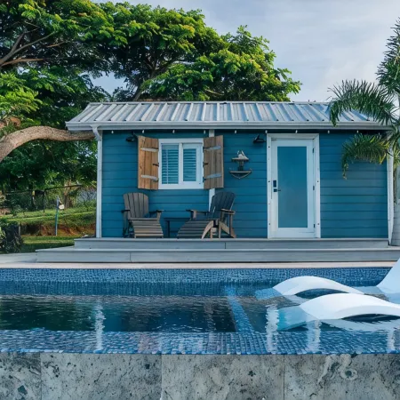 Tiny house on an acre with ocean view and private infinity pool.