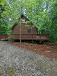 Cozy cabin with wrap around porch and only minutes to town!