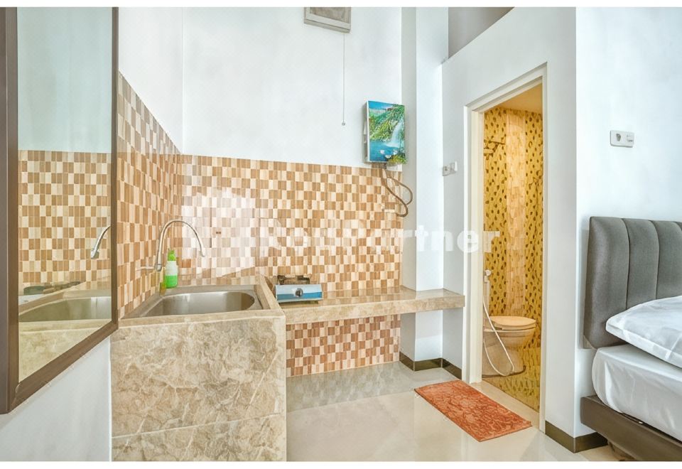 Griya Rahayu Guesthouse Mitra RedDoorz Near Jatim Park 2 Batu