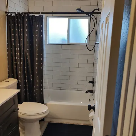 Centrally located close to everything with private entry and private yard.