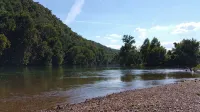Beautiful cabin style home backing up on the White River!