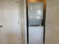 Executive Apt, a short walk to NYC train. King Bed. Free Parking. Central AC.