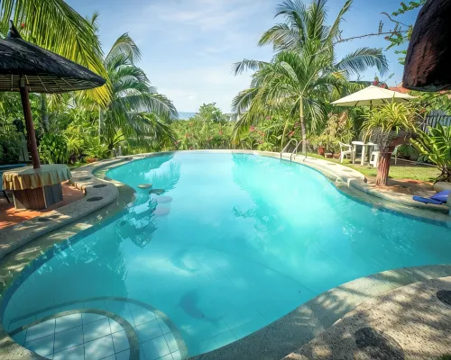 Spacious 5-bedroom Panglao Home with FREE transfers, Infinity Pool, WiFi, & A/C - 2-Star