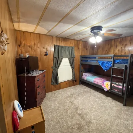 Quiet cabin in the woods w/ access to pools, river, & lakes in gated community!!