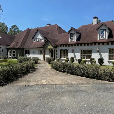 Escape to this serene 4-bedroom home set on 10 private acres.
