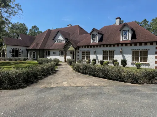 Escape to this serene 4-bedroom home set on 10 private acres.