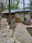 Historic Cabin in a natural setting with waterfalls and covered bridge