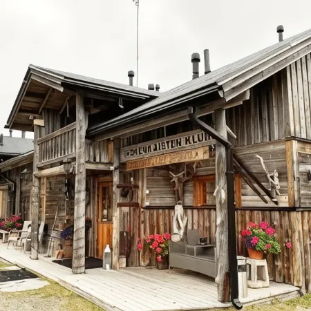 Isokenkäisten Klubi - Wilderness Lodge