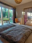 Spacious vacation apartment with fireplace and barrel sauna in the sheltered garden. - Wifi