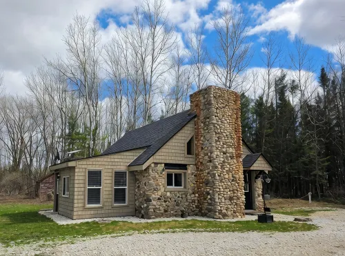 Escape to "The Woods": A Secluded Stone Cabin Retreat.