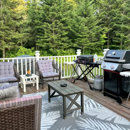 Spacious five-bedroom home off Back Lake with direct trail access on Spooner Rd