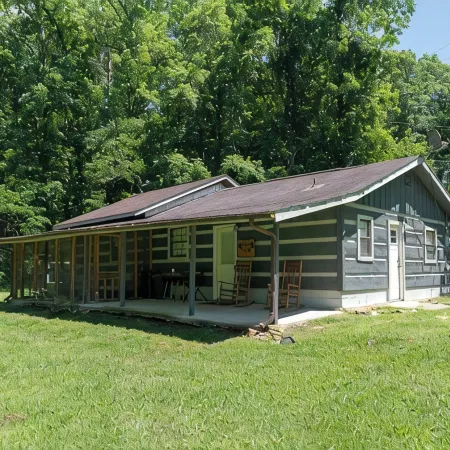 Moonshine Cabin with a nice yard on the creek in the shadows of the Smokies