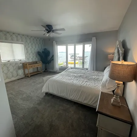 Enjoy this beach front lake home that boasts 66' of frontage with many amenities