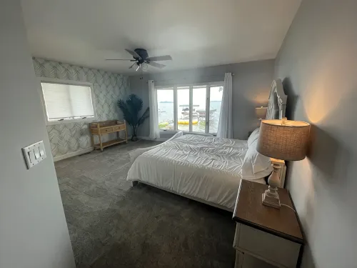 Enjoy this beach front lake home that boasts 66' of frontage with many amenities