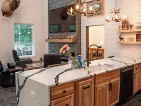 Modern mountain- inspired monoslope home located in the beautiful Northwoods Hotels in Round Lake