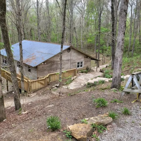 Historic Cabin in a natural setting with waterfalls and covered bridge