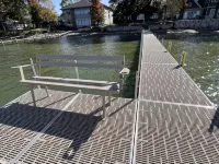Enjoy this beach front lake home that boasts 66' of frontage with many amenities